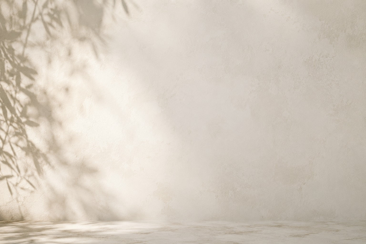 Beige background with soft shadows and a subtle texture