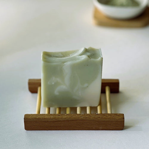Nuada Naturals Atlantic Breeze pale green swirl soap bar sitting on wooden tray