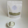 Nuada Naturals Deep Forest bath soak pouch with small dish of green herbal salts
