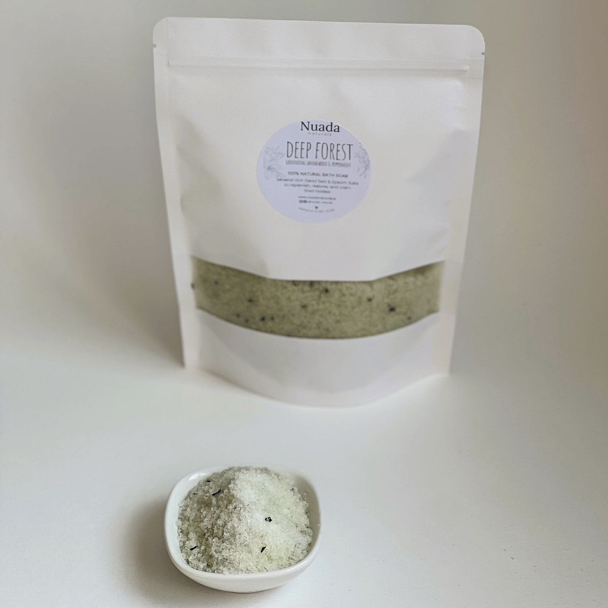 Nuada Naturals Deep Forest bath soak pouch with small dish of green herbal salts