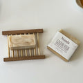 Nuada Naturals Golden Hour sandalwood, bergamot, and turmeric soap with branded wrapper