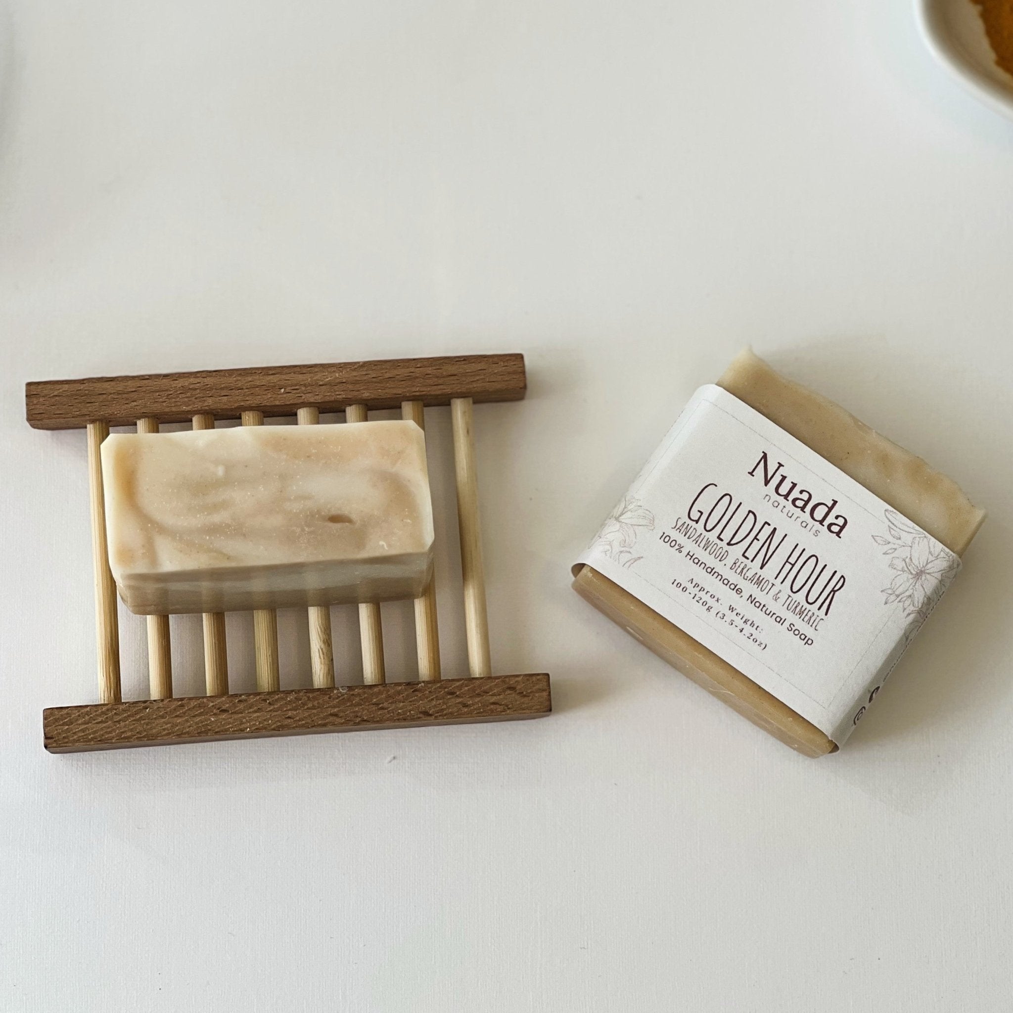 Nuada Naturals Golden Hour sandalwood, bergamot, and turmeric soap with branded wrapper